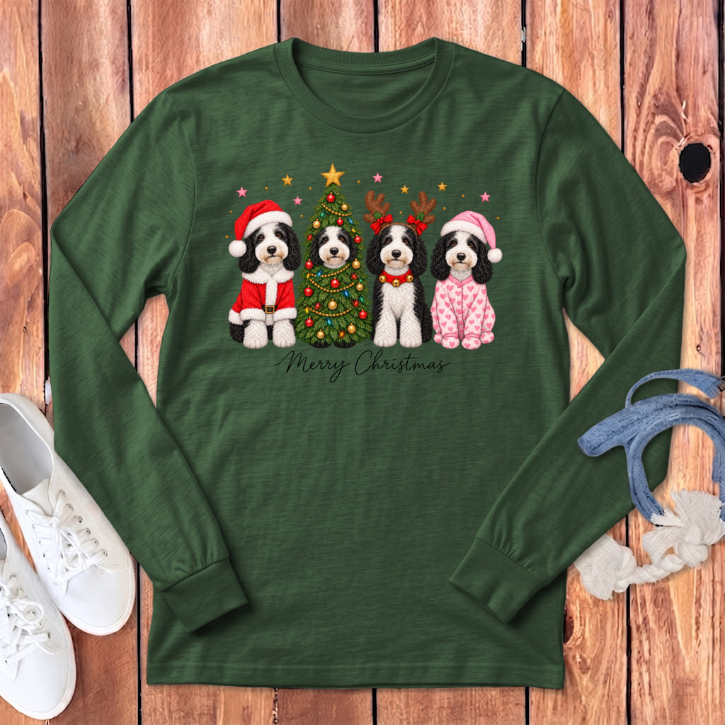 Dark green long-sleeve t-shirt with a graphic of four dogs celebrating Christmas with a tree and the text "Merry Christmas".
