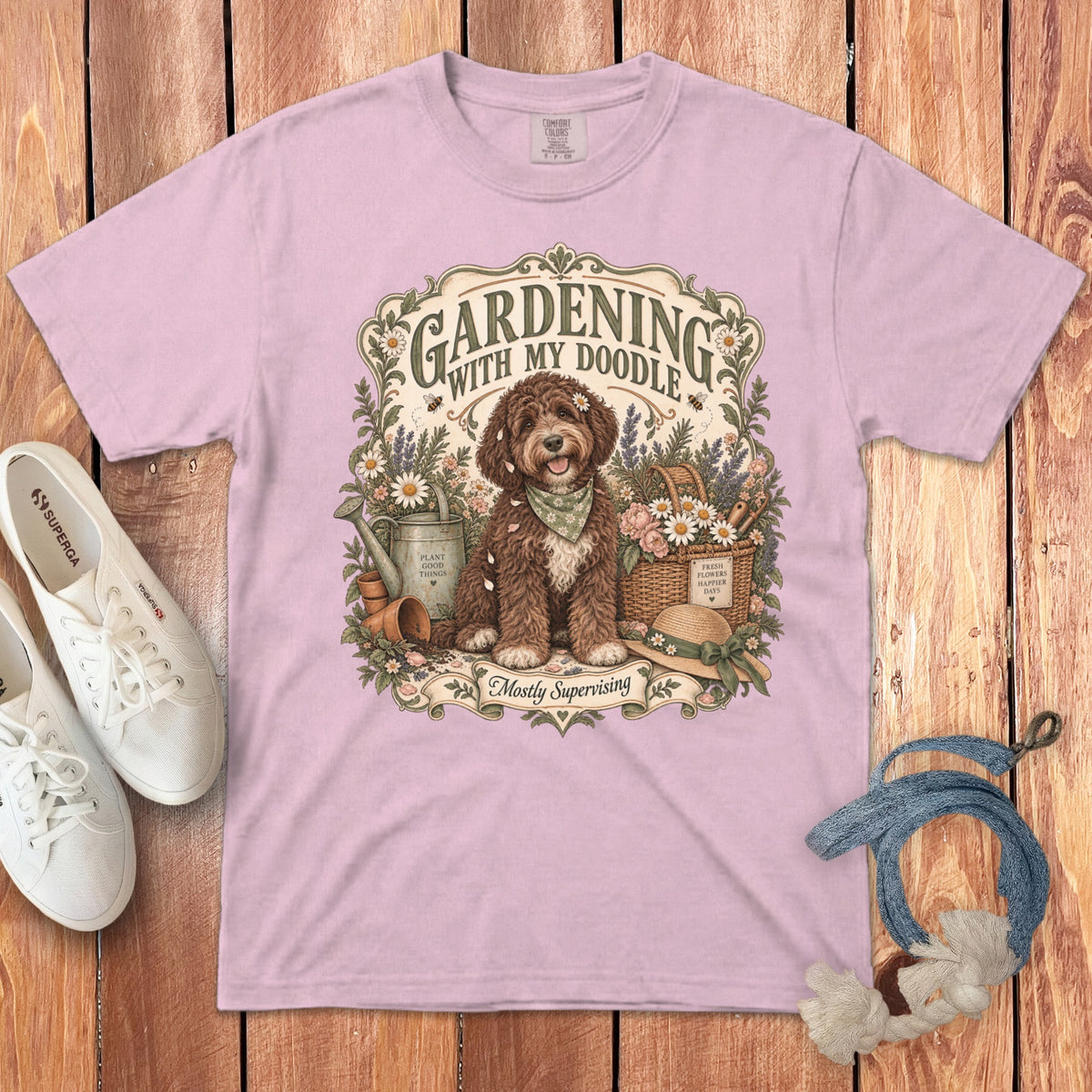 Pink t-shirt with "Gardening with My Doodle" graphic of a dog and garden items.