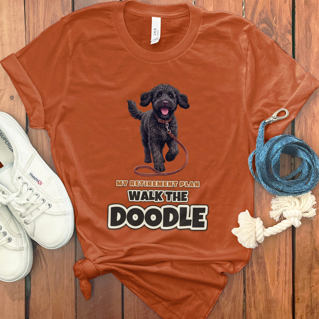 Orange t-shirt with "My Retirement Plan Walk the Doodle" text and a black doodle dog.