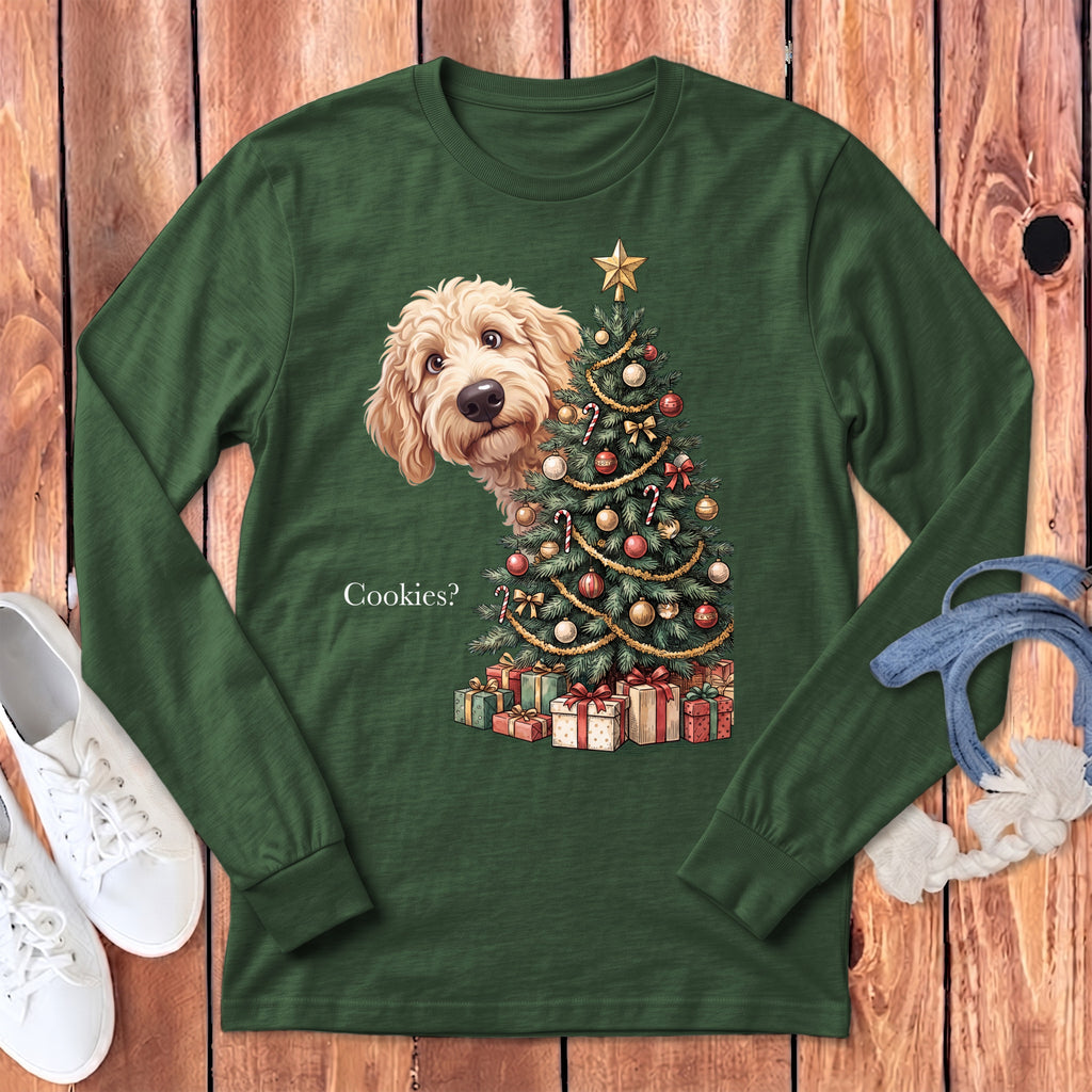 Green long-sleeve shirt with a doodle dog peeking by a Christmas tree and presents.