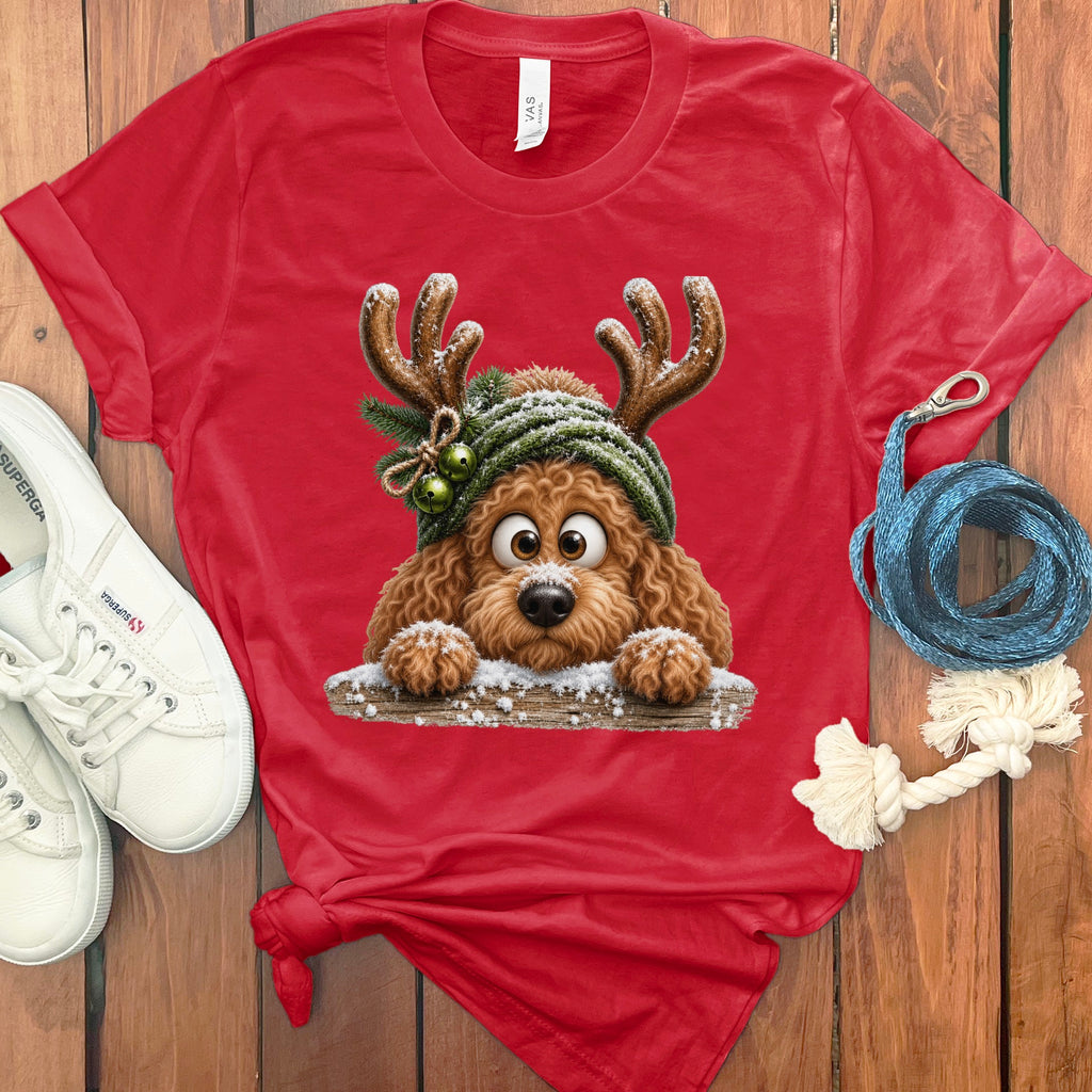 Red t-shirt with cartoon dog wearing reindeer antlers and green beanie.