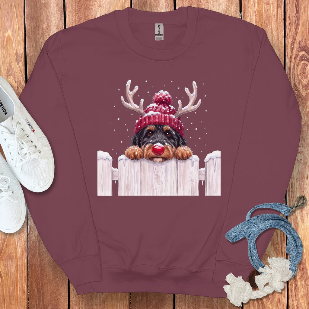 Burgundy sweatshirt with a graphic of a dog wearing a Santa hat and reindeer antlers.