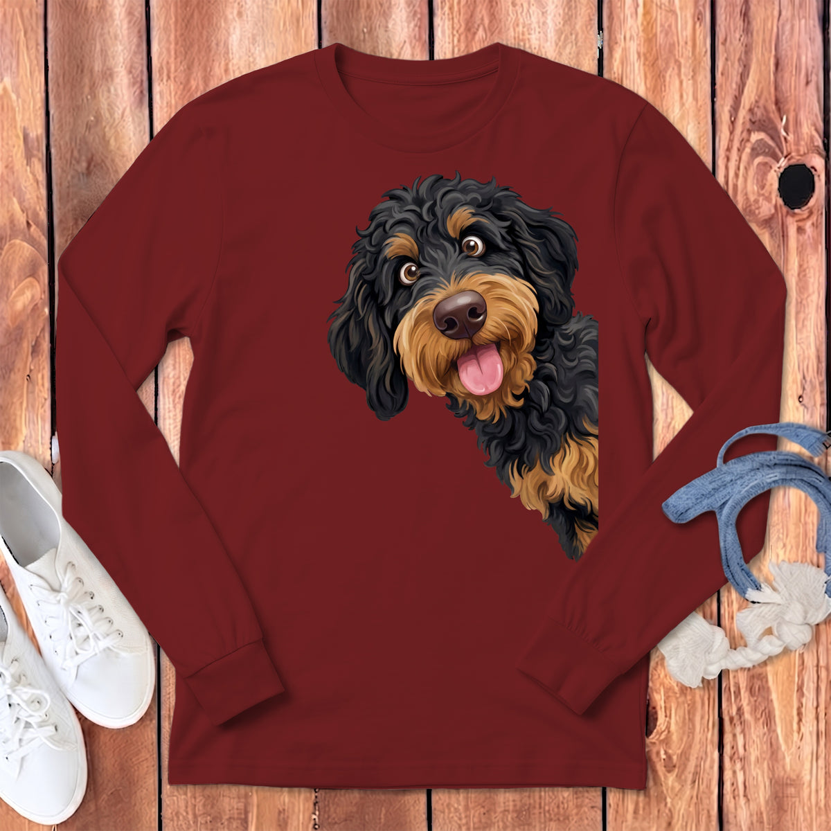 Maroon long-sleeve t-shirt with black and tan doodle dog graphic.
