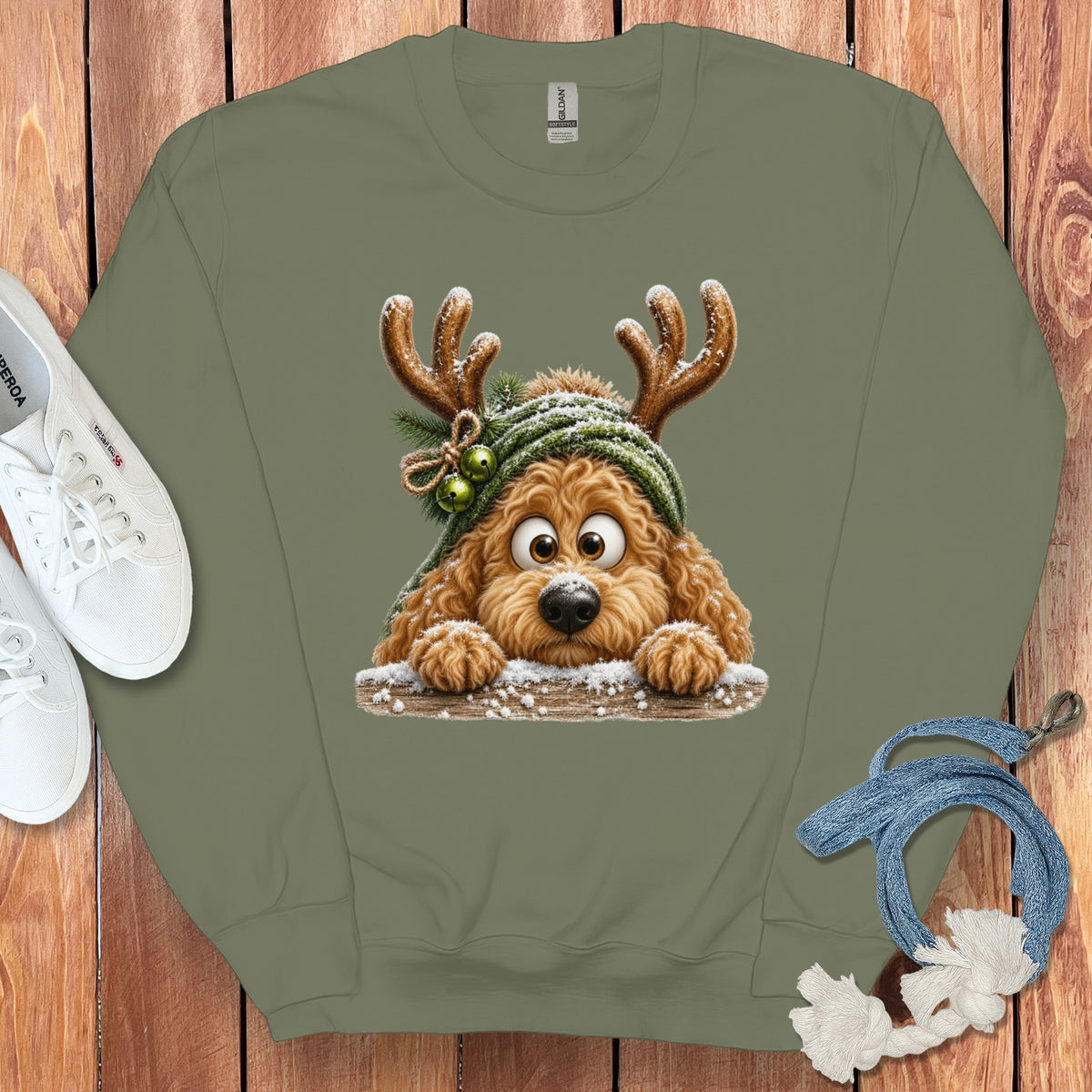Green sweatshirt with a cartoon dog wearing reindeer antlers and a green hat.