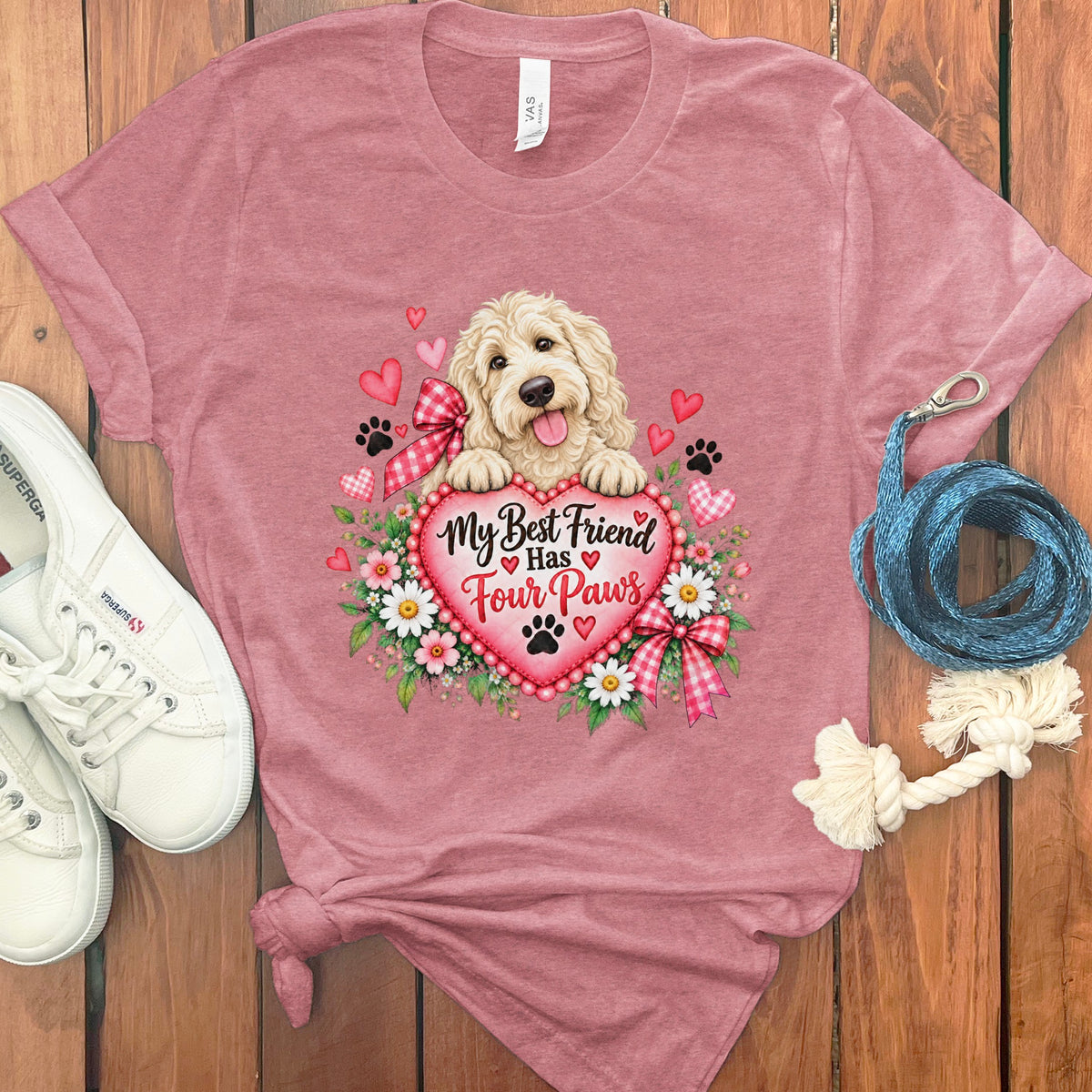 Heather pink t-shirt featuring a Golden Doodle puppy behind a heart with the text My Best Friend Has Four Paws.
