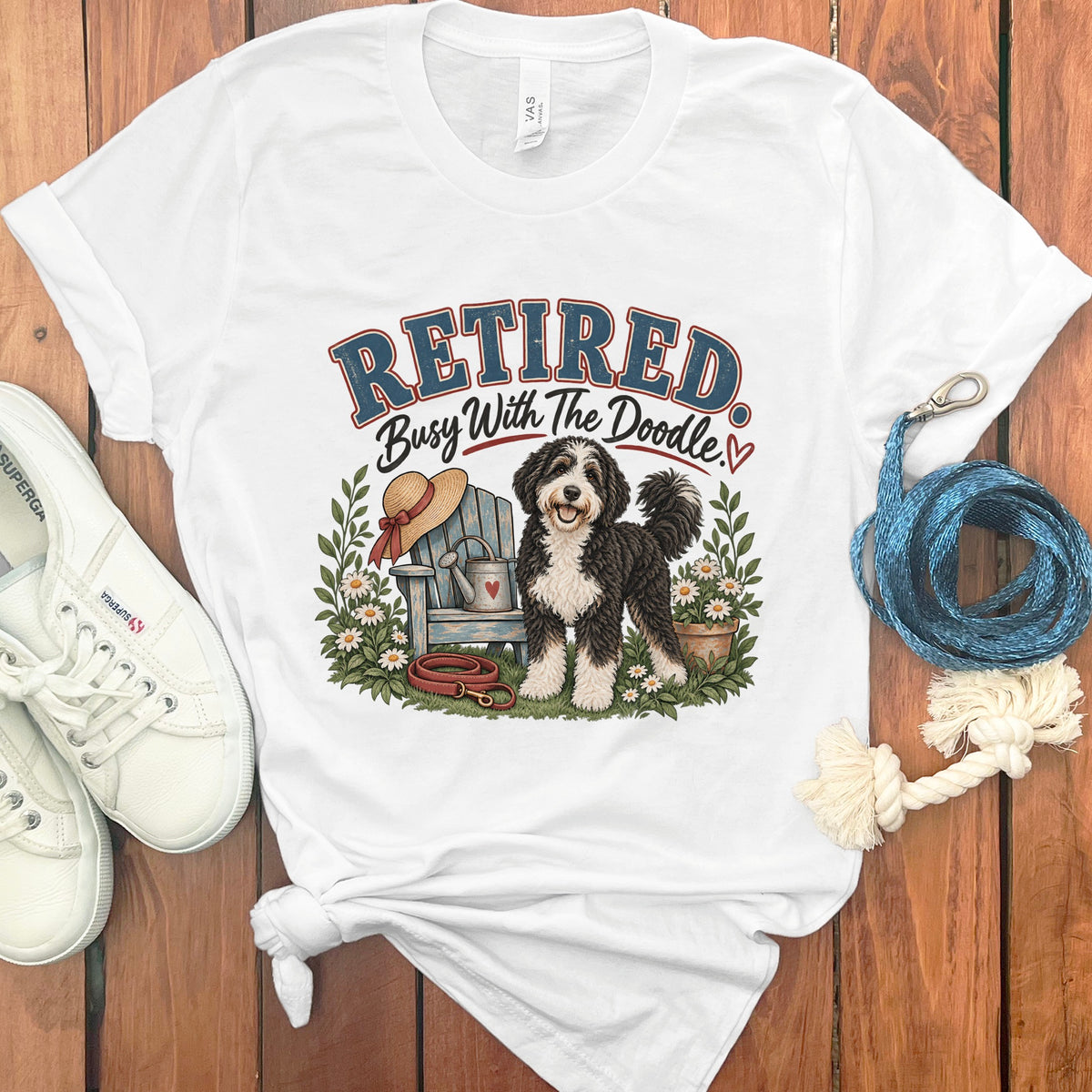 White t-shirt with graphic "Retired Busy With The Doodle" and a doodle dog.