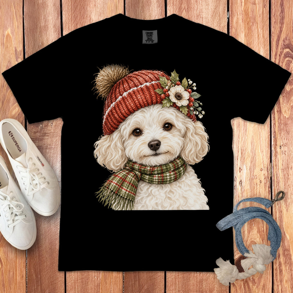 Black t-shirt with fluffy white dog wearing red hat and green scarf.