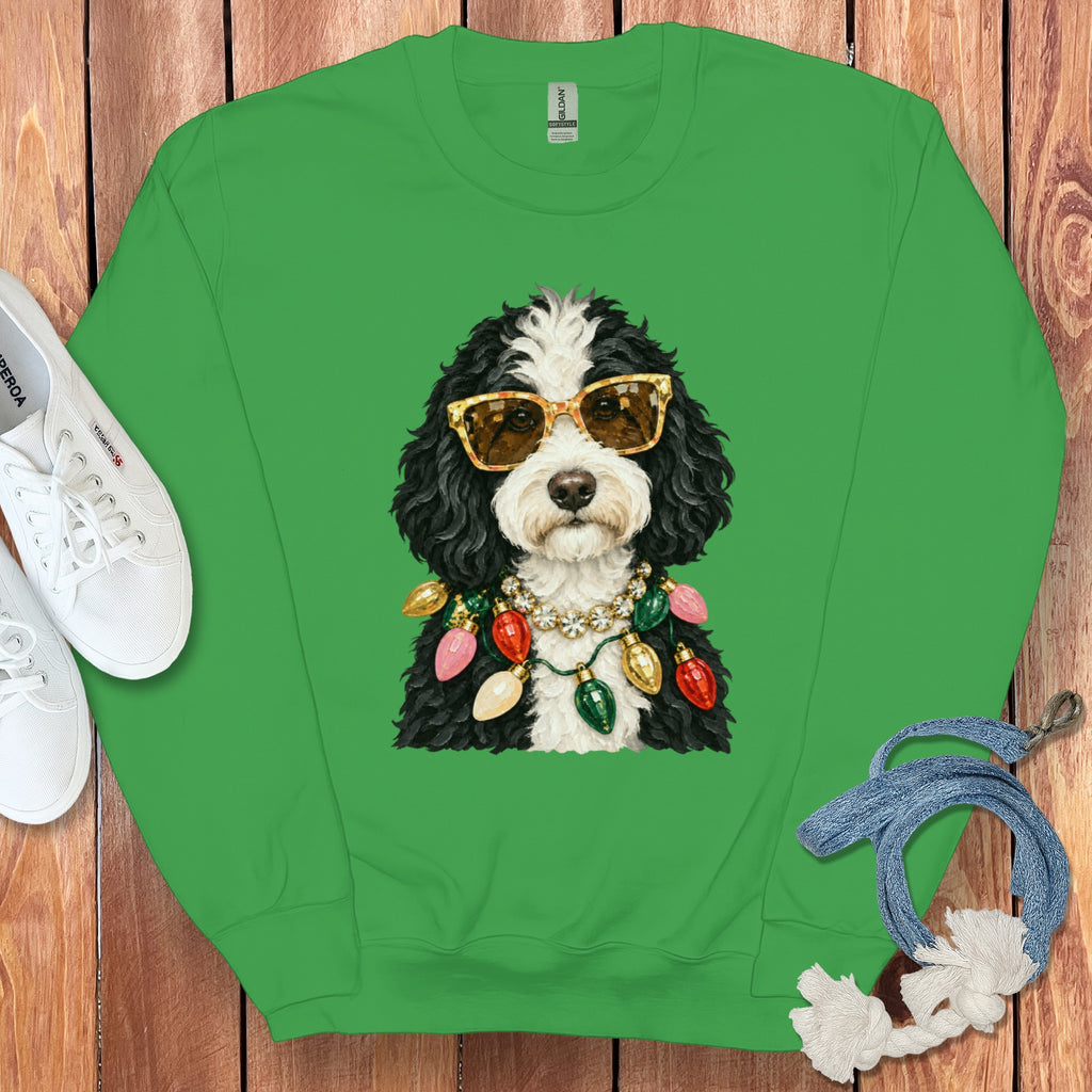 Green crewneck sweatshirt with a dog wearing sunglasses and Christmas lights.