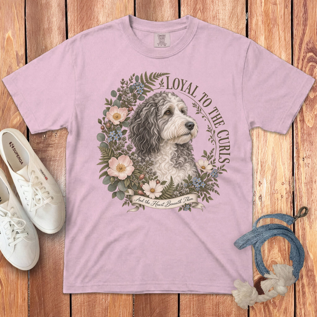 Pink t-shirt with a doodle dog portrait in a floral wreath and text "Loyal to the Curls".