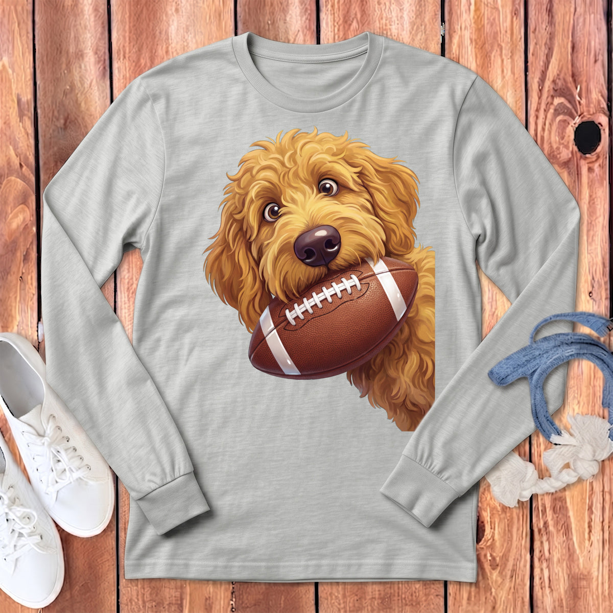 Light gray long-sleeve t-shirt with a golden doodle dog biting a football graphic.