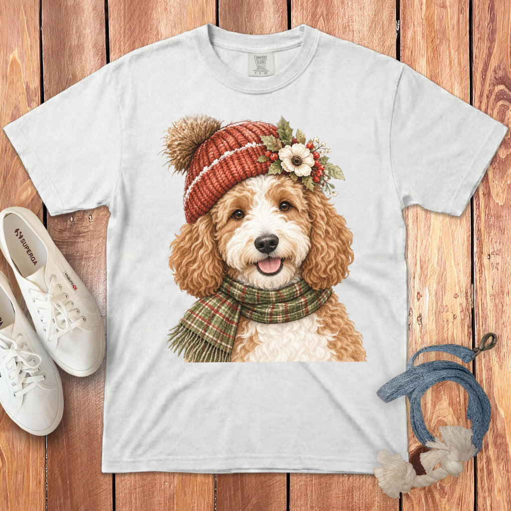 White t-shirt featuring a doodle dog wearing a winter hat and scarf.