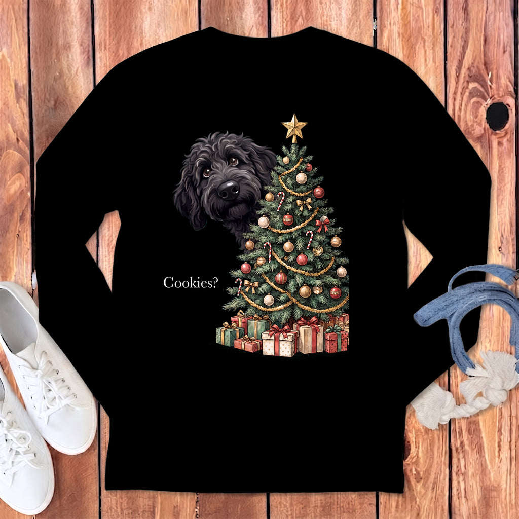 Black t-shirt with a black doodle peeking by a Christmas tree and gifts.