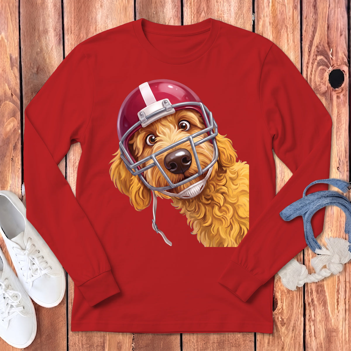 Red long-sleeve shirt featuring a cartoon goldendoodle wearing a red football helmet.