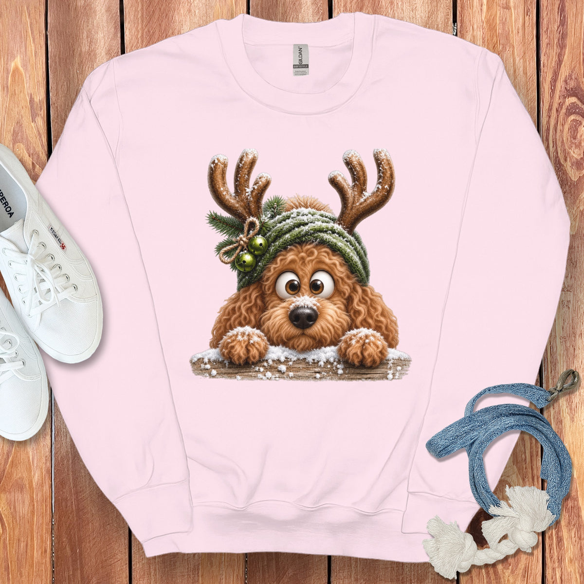 Light pink sweatshirt with a cartoon dog wearing antlers and a green hat.