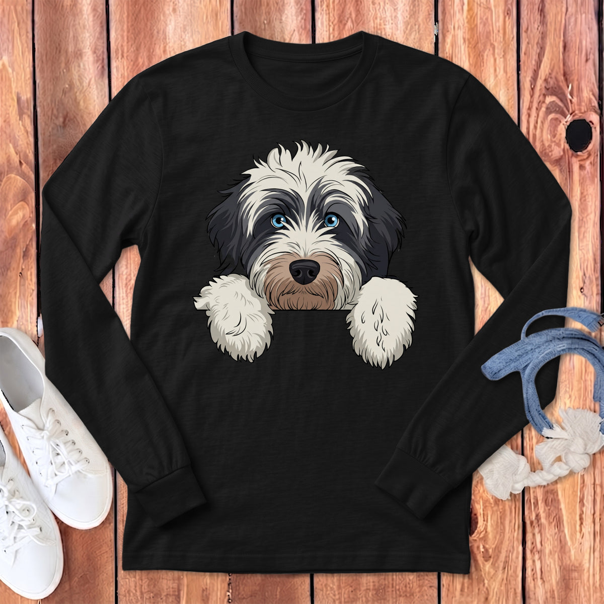 Black long sleeve shirt with an illustration of a dog's face peeking over the collar.