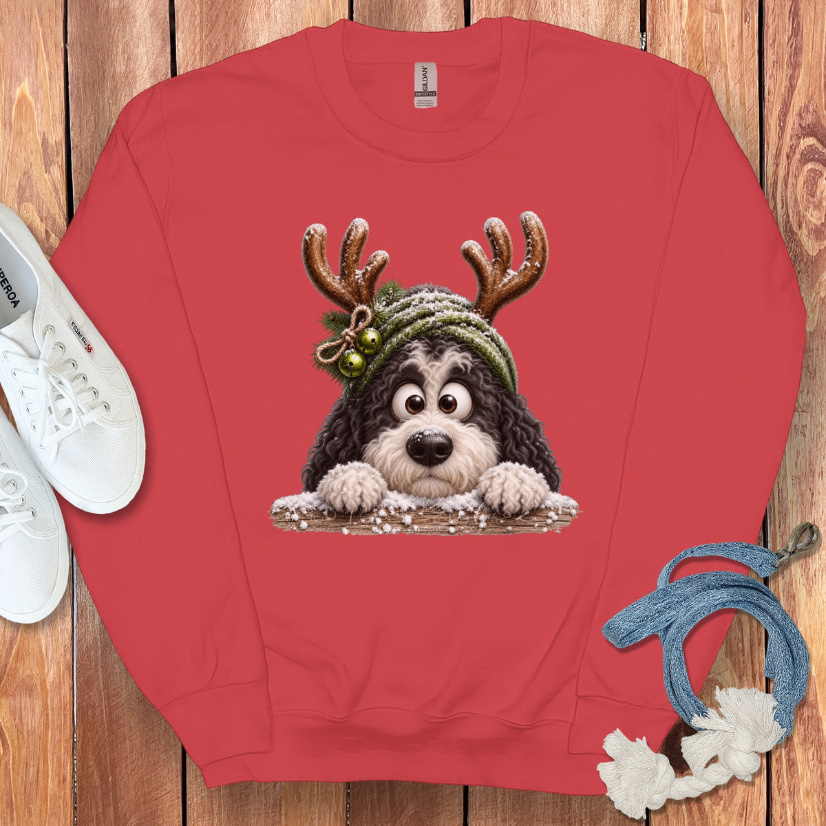 Red sweatshirt with a cartoon dog wearing reindeer antlers and a Santa hat.