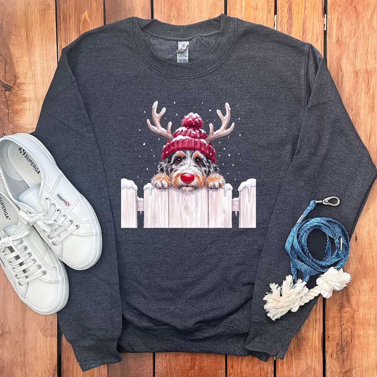 Dark gray sweatshirt with a Christmas dog graphic and white sneakers.