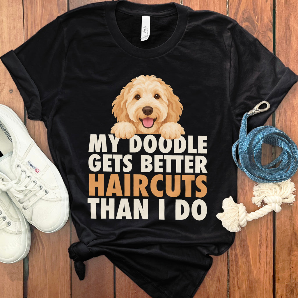 Black t-shirt with cartoon doodle dog graphic and text "My doodle gets better haircuts than I do".