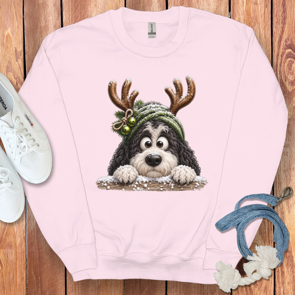 Pink sweatshirt with illustration of a dog wearing reindeer antlers and a Santa hat.