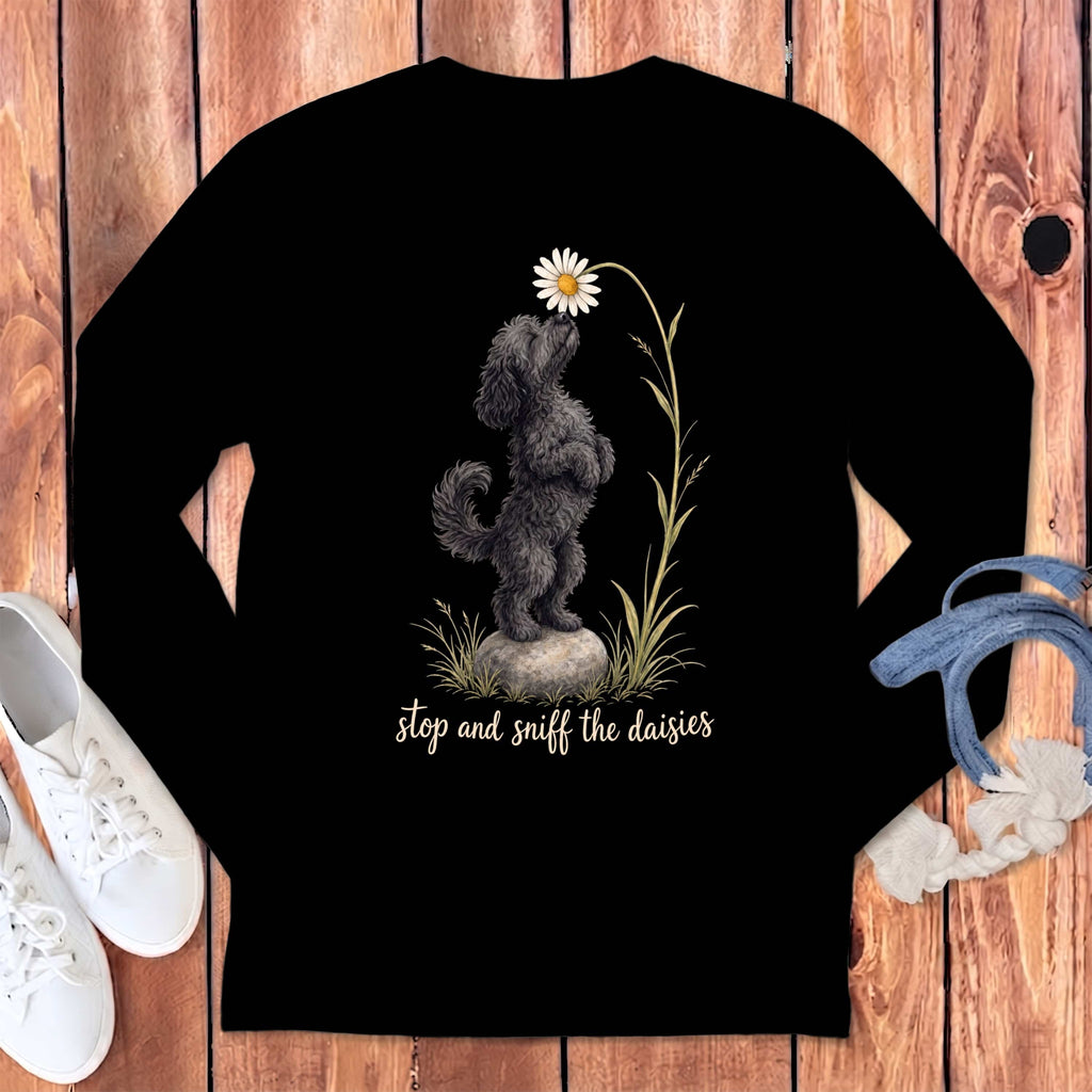 Black long-sleeve shirt with a poodle sniffing a daisy and the text "stop and sniff the daisies."