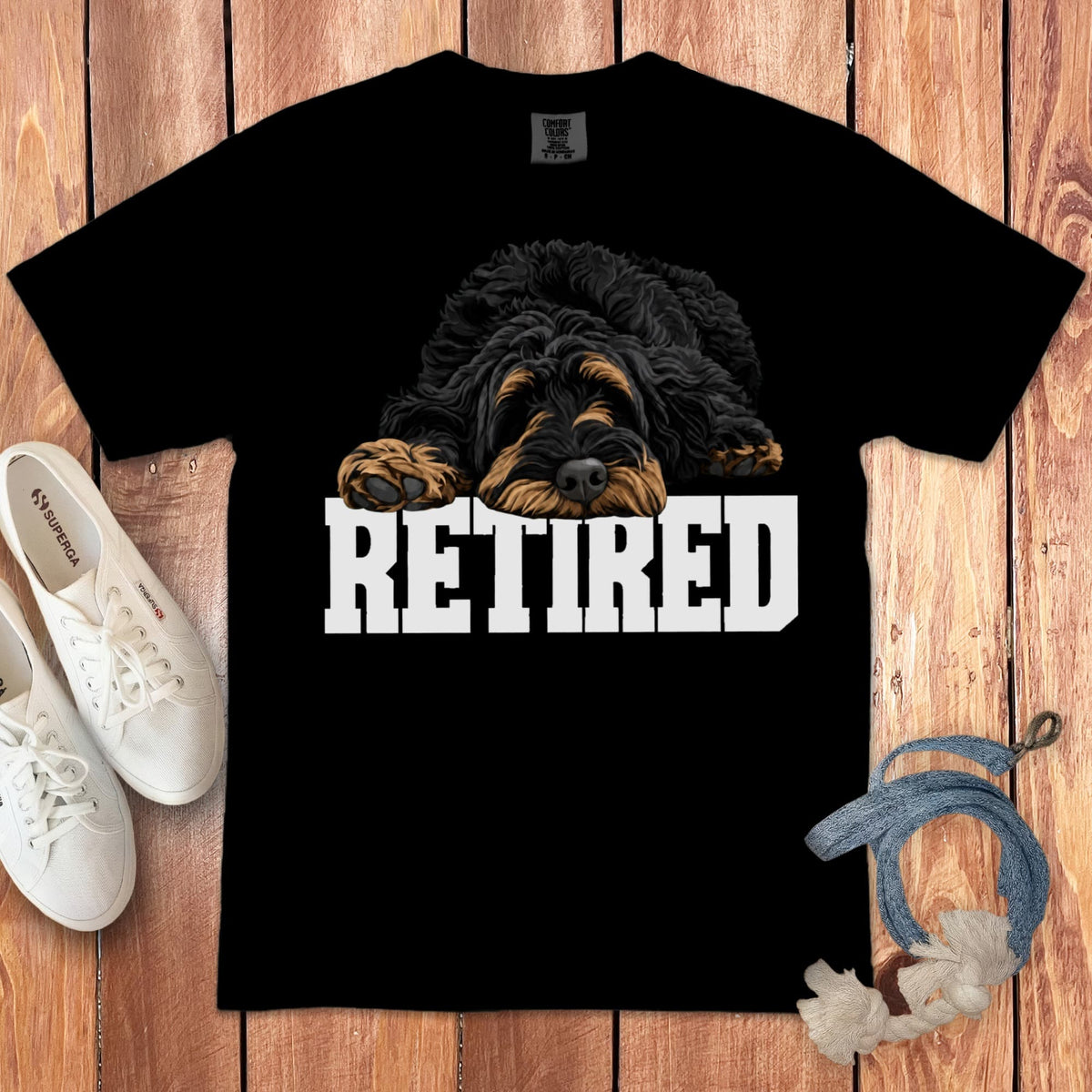 Black t-shirt with a tired dog graphic and the word "RETIRED" below.