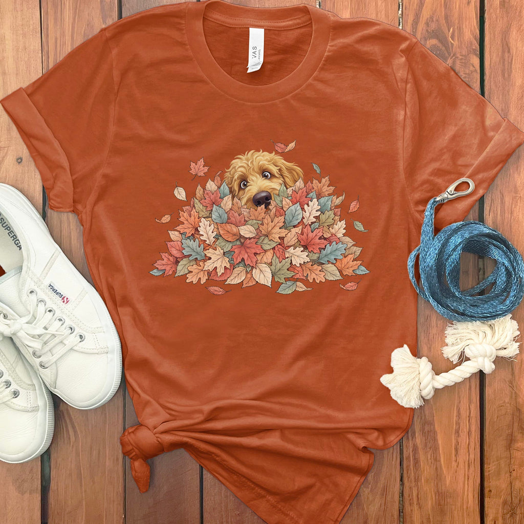 Apricot Goldendoodle Peeking Leaf Pile T-Shirt in Autumn / S by Puppy Jo