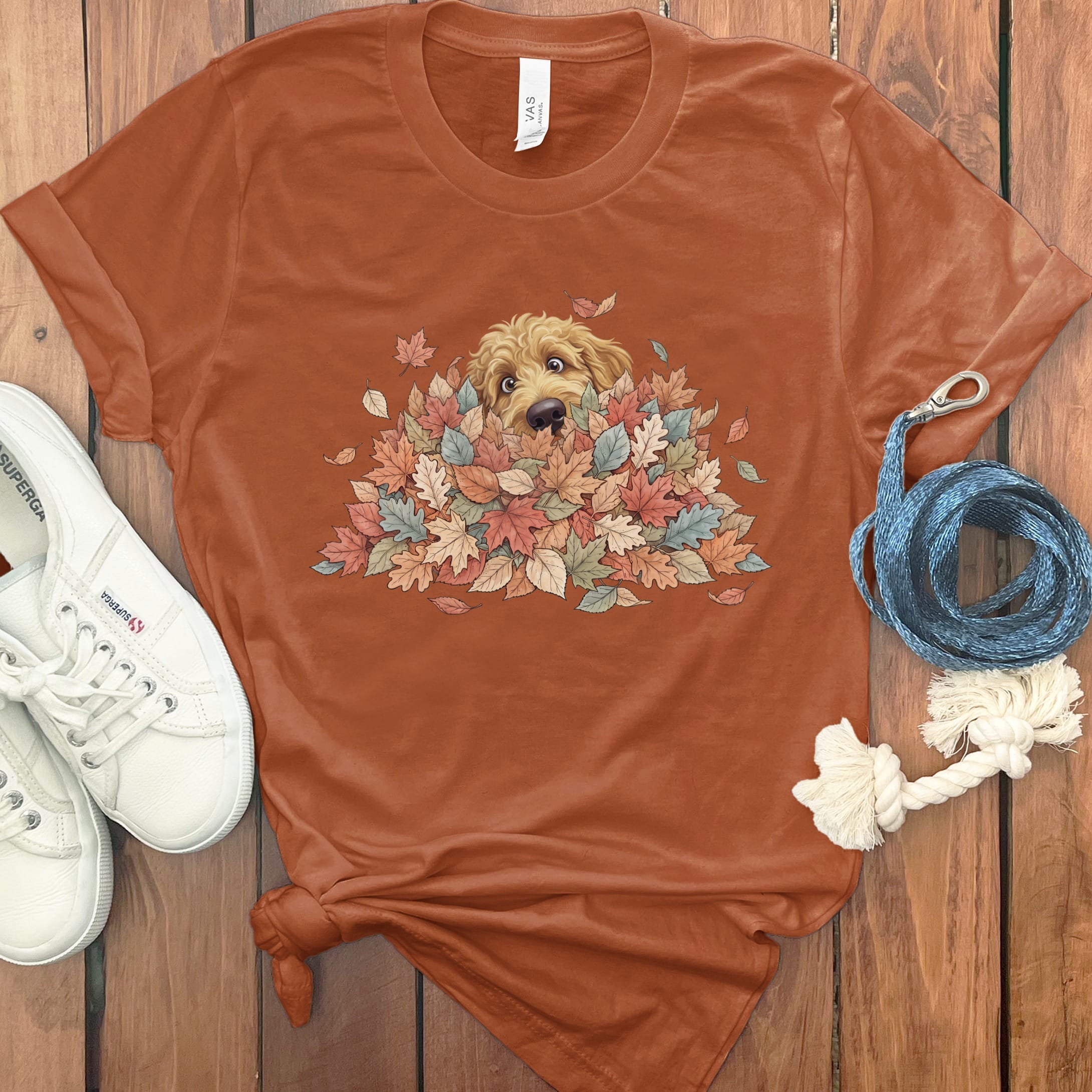 Apricot Goldendoodle Peeking Leaf Pile T-Shirt in Autumn / S by Puppy Jo
