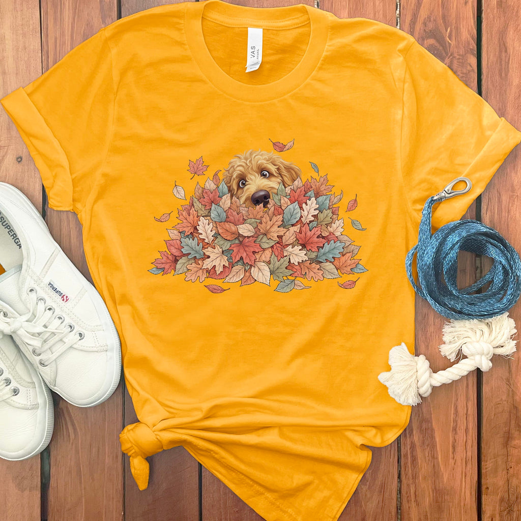 Apricot Goldendoodle Peeking Leaf Pile T-Shirt in Gold / S by Puppy Jo
