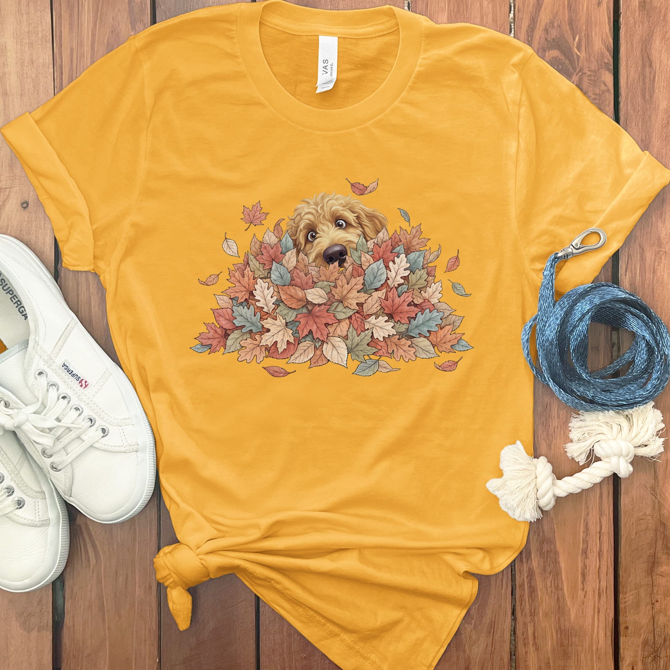 Apricot Goldendoodle Peeking Leaf Pile T-Shirt in Gold / S by Puppy Jo