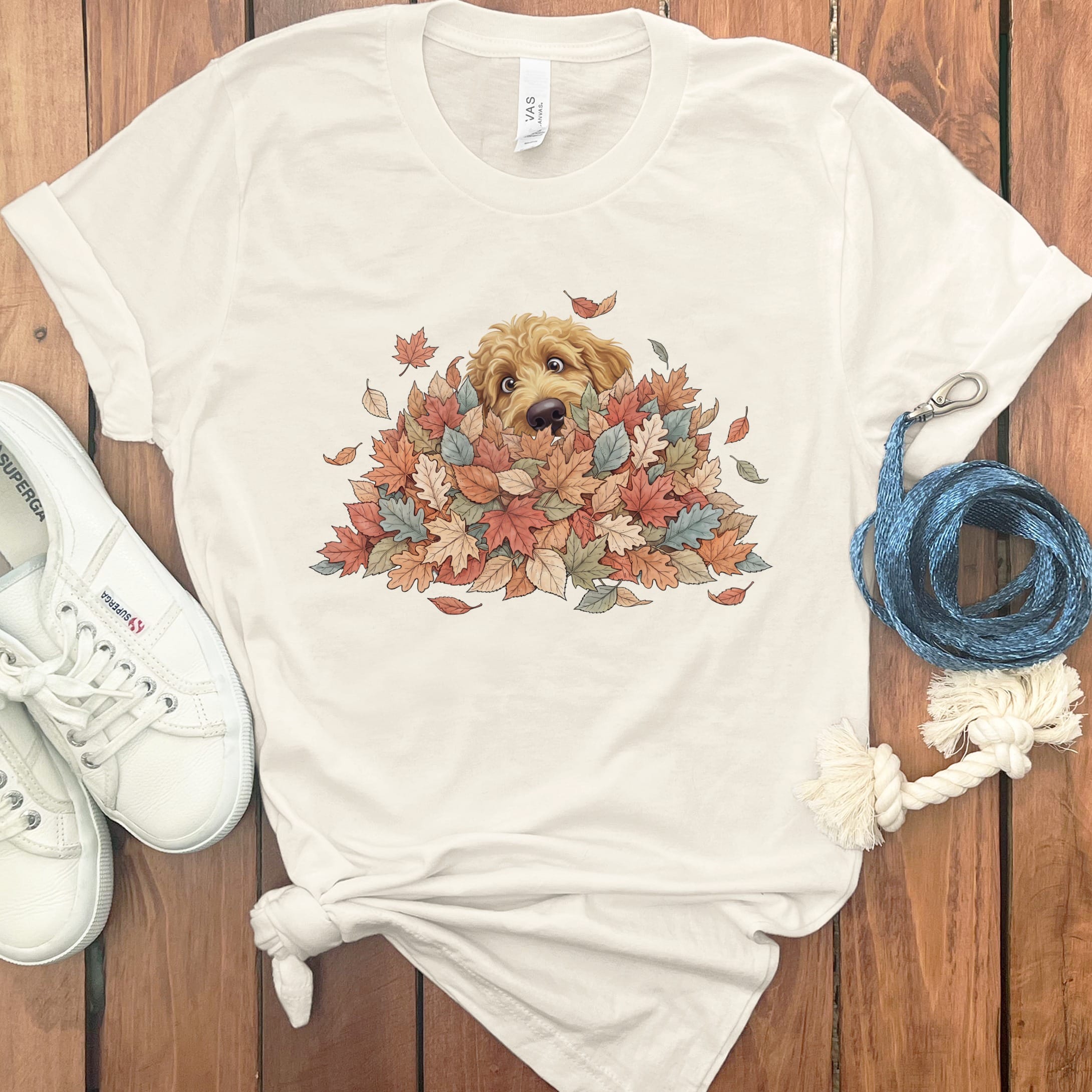 Apricot Goldendoodle Peeking Leaf Pile T-Shirt in Natural / S by Puppy Jo