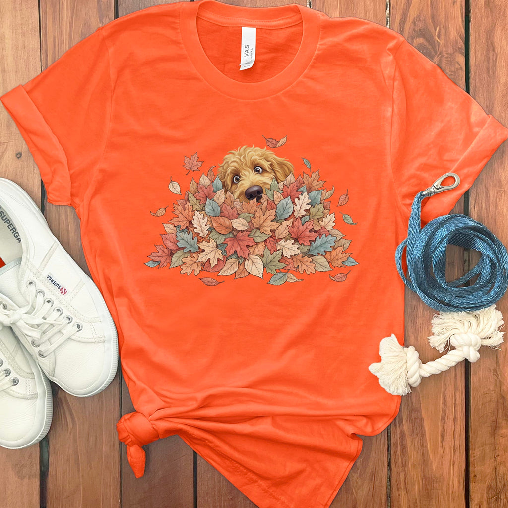 Apricot Goldendoodle Peeking Leaf Pile T-Shirt in Orange / S by Puppy Jo