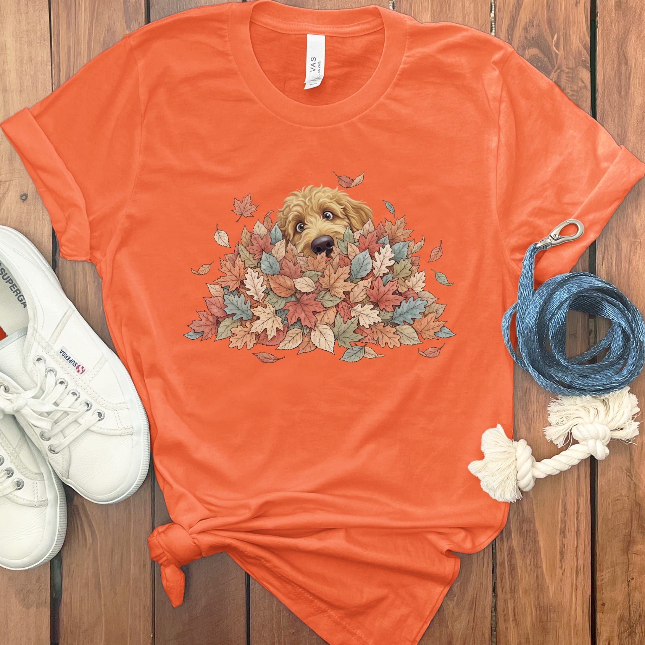 Apricot Goldendoodle Peeking Leaf Pile T-Shirt in Orange / S by Puppy Jo