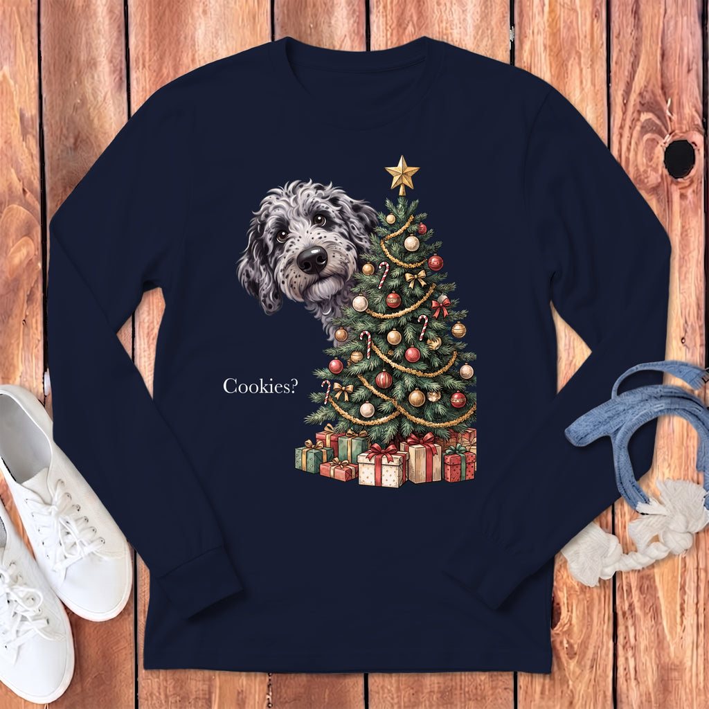 Dog peeking behind Christmas tree with presents and text "Cookies?".