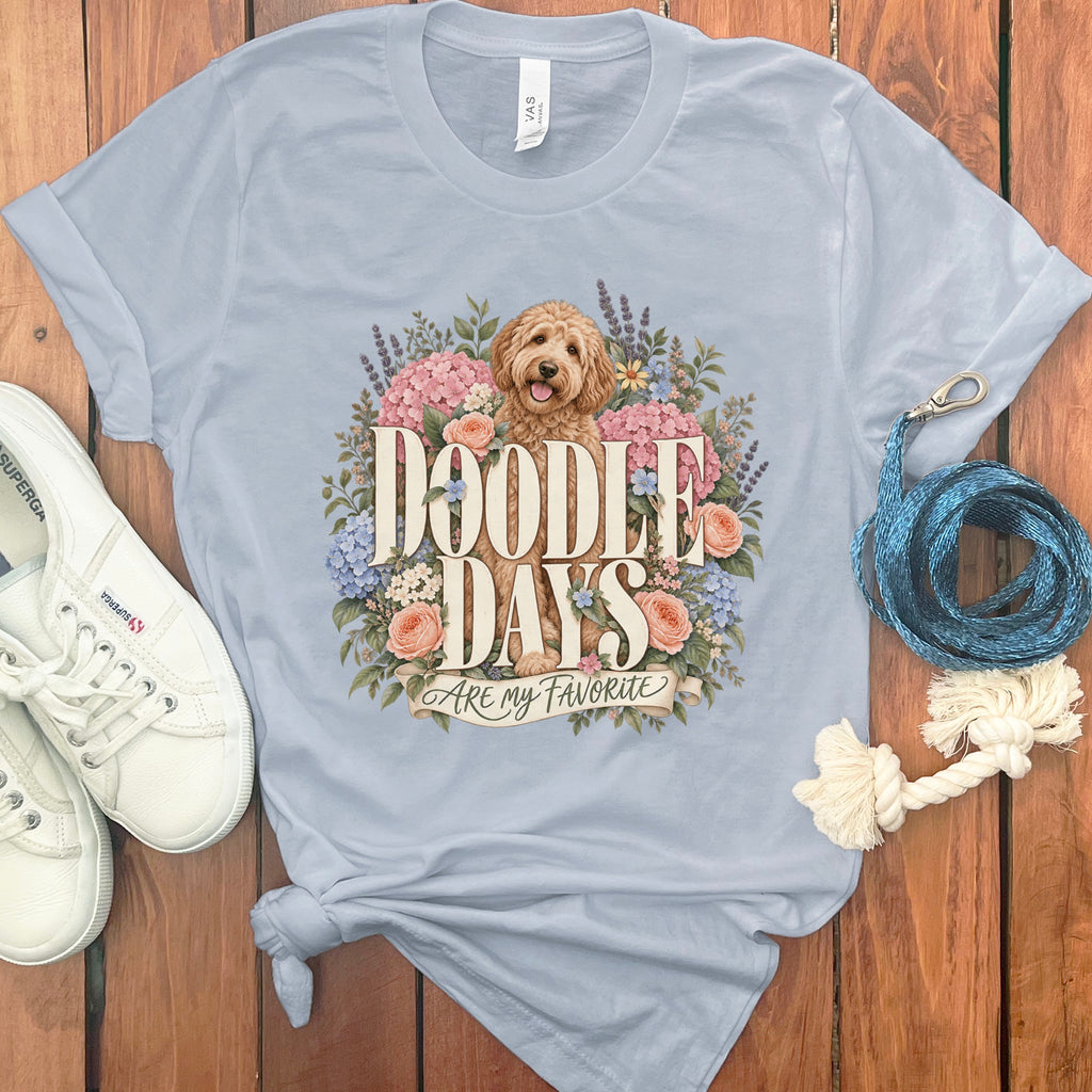 Light blue t-shirt with a doodle dog and flowers graphic saying "Doodle Days Are My Favorite".