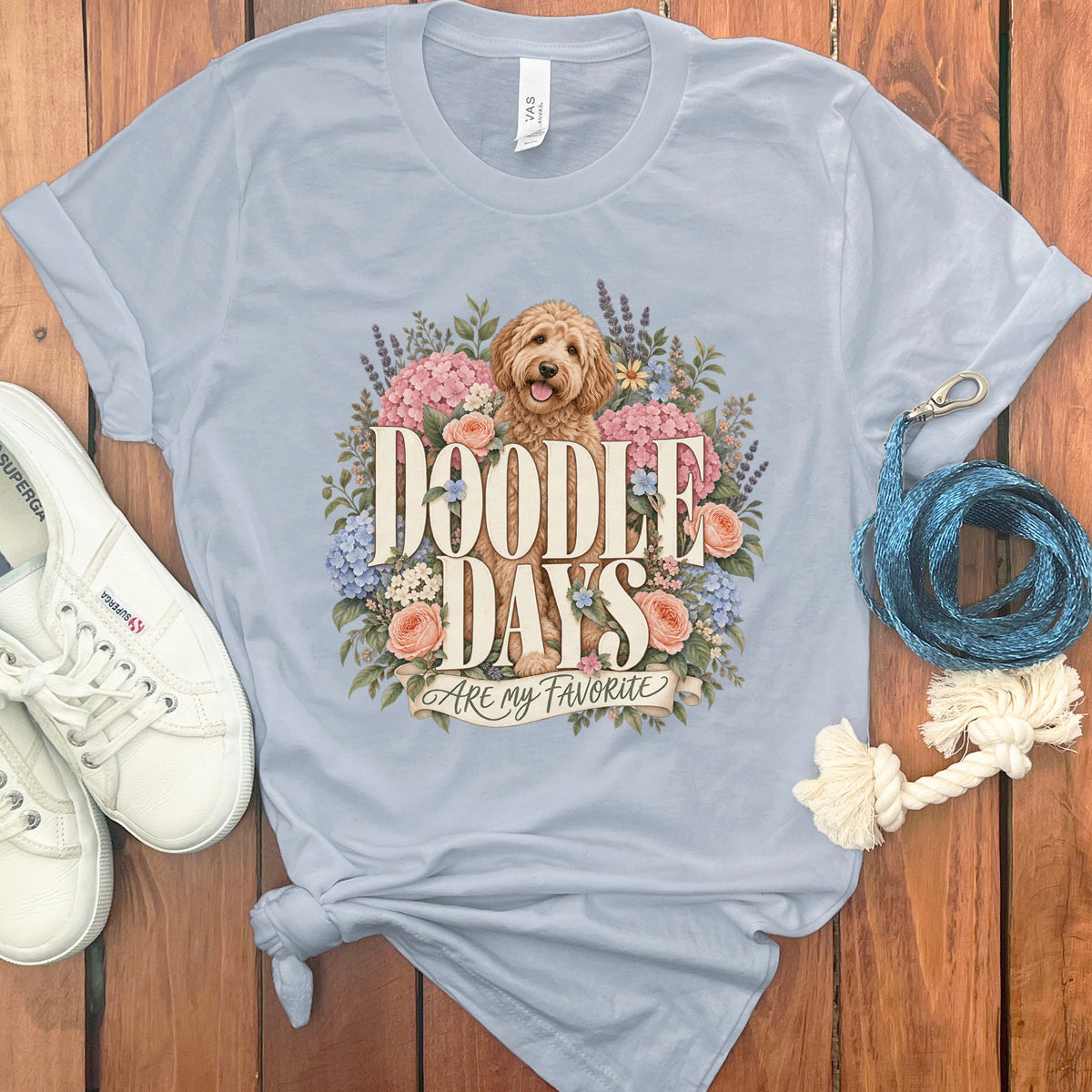 Light blue t-shirt with a doodle dog and flowers graphic saying "Doodle Days Are My Favorite".