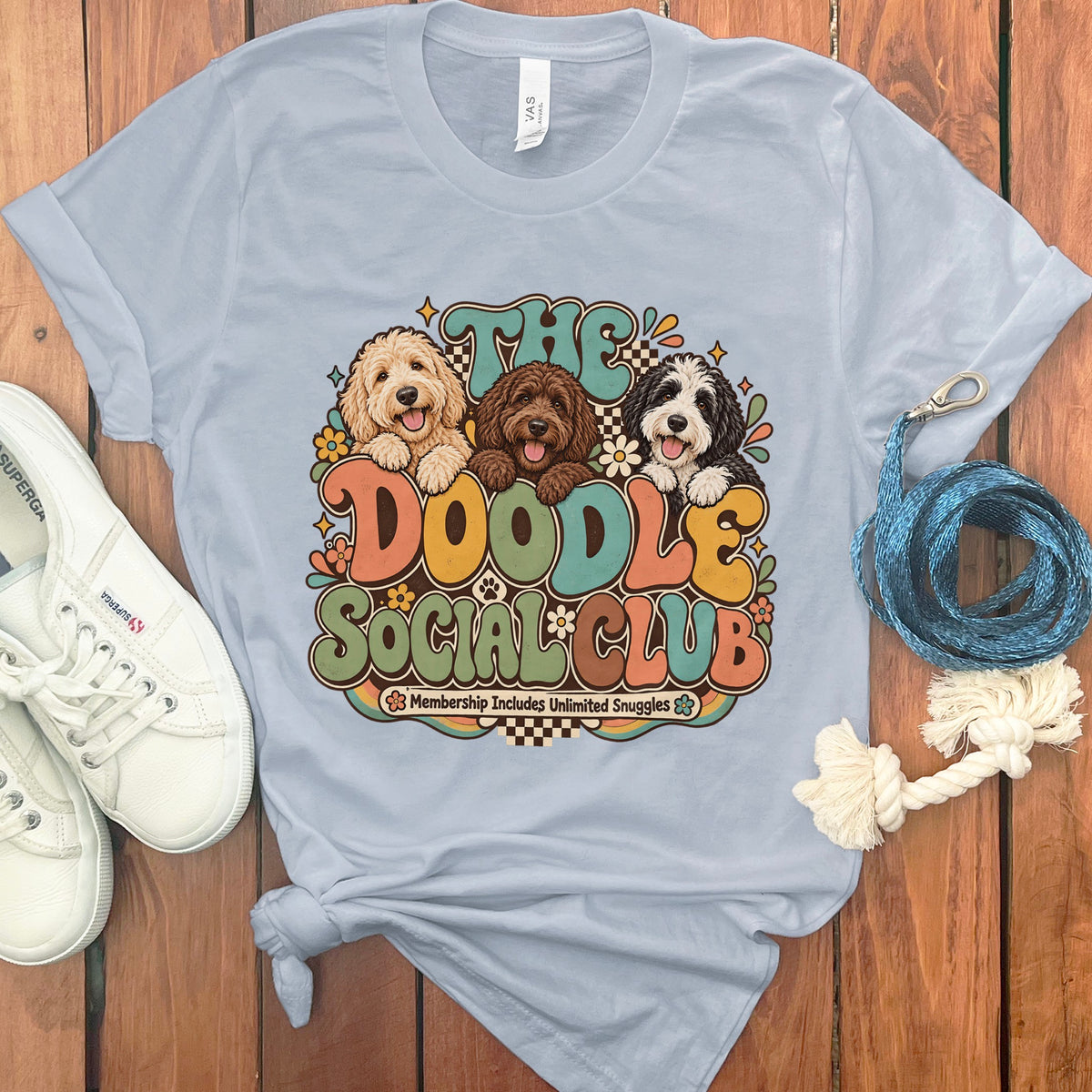 Light blue t-shirt with "The Doodle Social Club" and three doodle dogs.