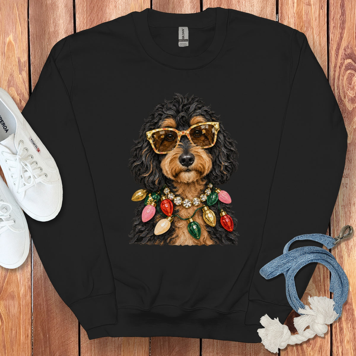 Black crewneck sweatshirt with a doodle dog wearing sunglasses and a Christmas light necklace.