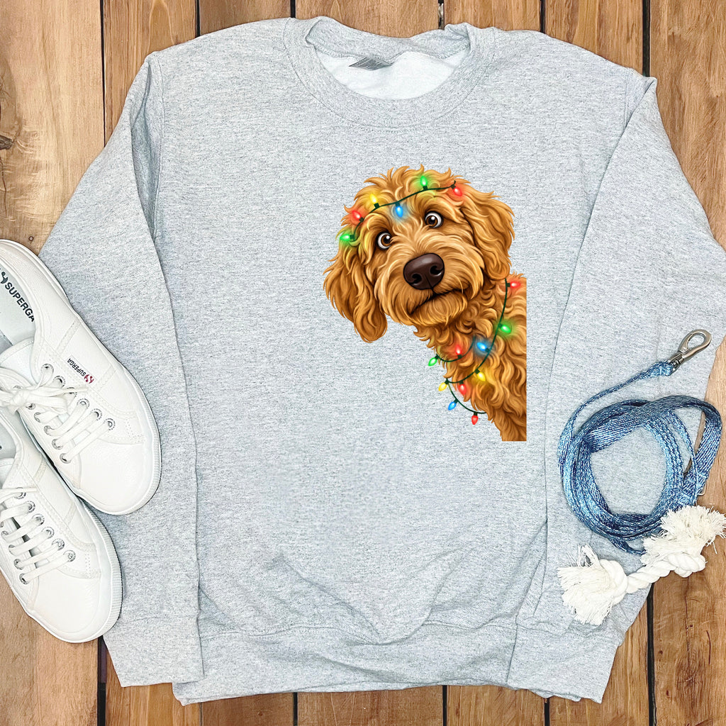 Light gray crewneck sweatshirt with a doodle dog wearing Christmas lights graphic.