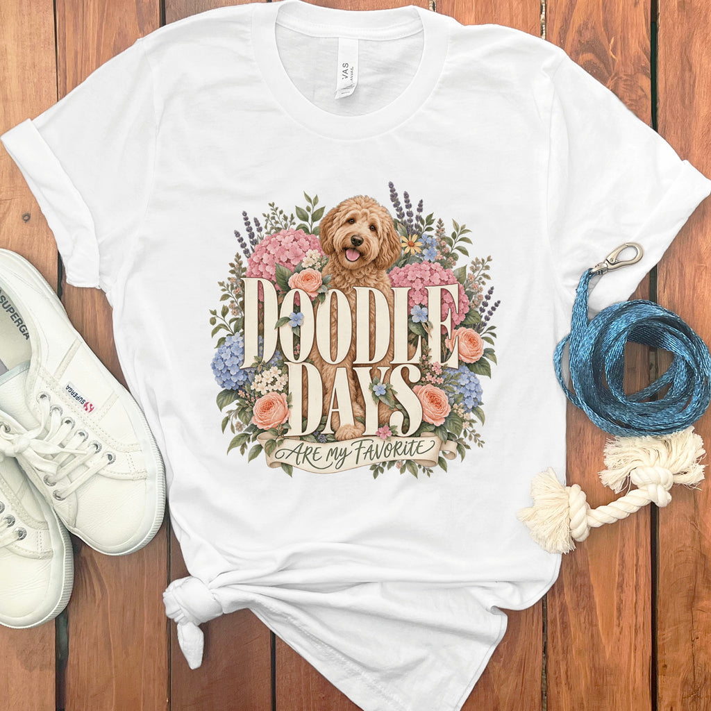 White t-shirt with a doodle dog, flowers, and "Doodle Days Are My Favorite" text.
