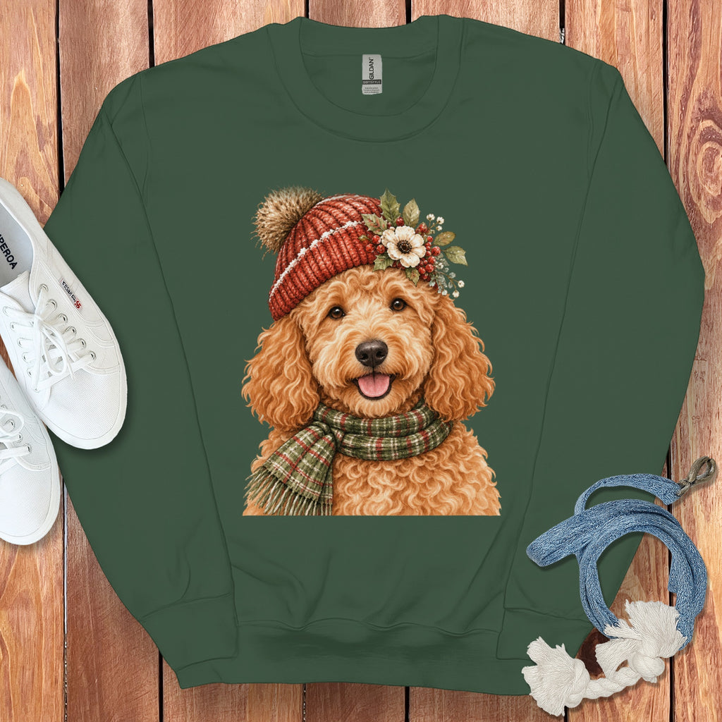Green crewneck sweatshirt with a watercolor doodle dog wearing a red beanie and plaid scarf.