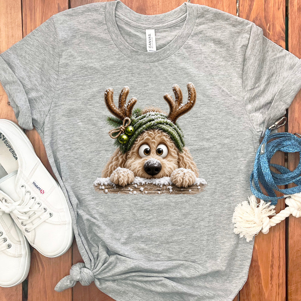 Grey t-shirt with cartoon dog wearing reindeer antlers and a hat.