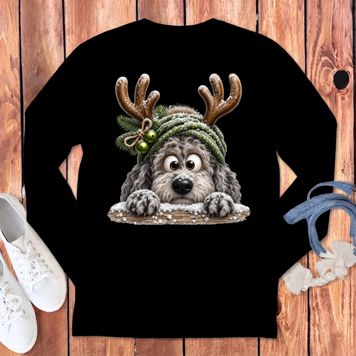 Black long-sleeve shirt with a fluffy dog wearing reindeer antlers and a knit hat.