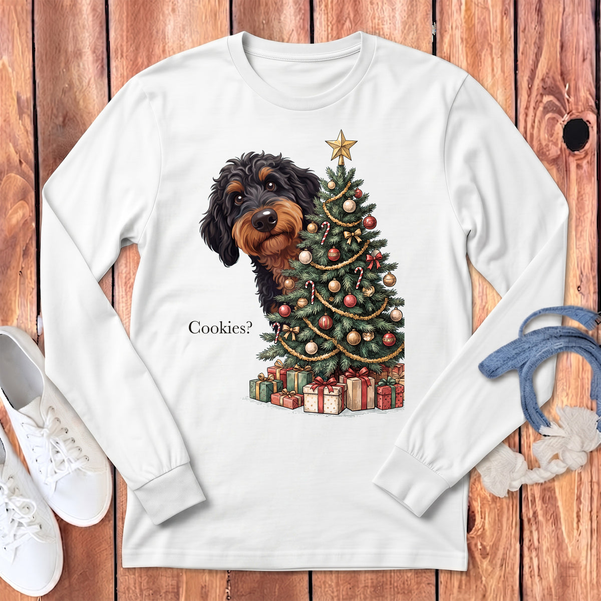 Wirehaired dog peeking out from behind a Christmas tree with gifts, saying "Cookies?".