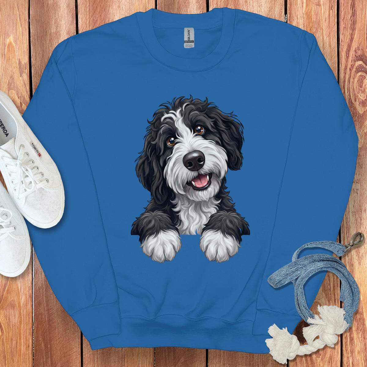 Blue sweatshirt with black and white dog graphic and Gildan label.