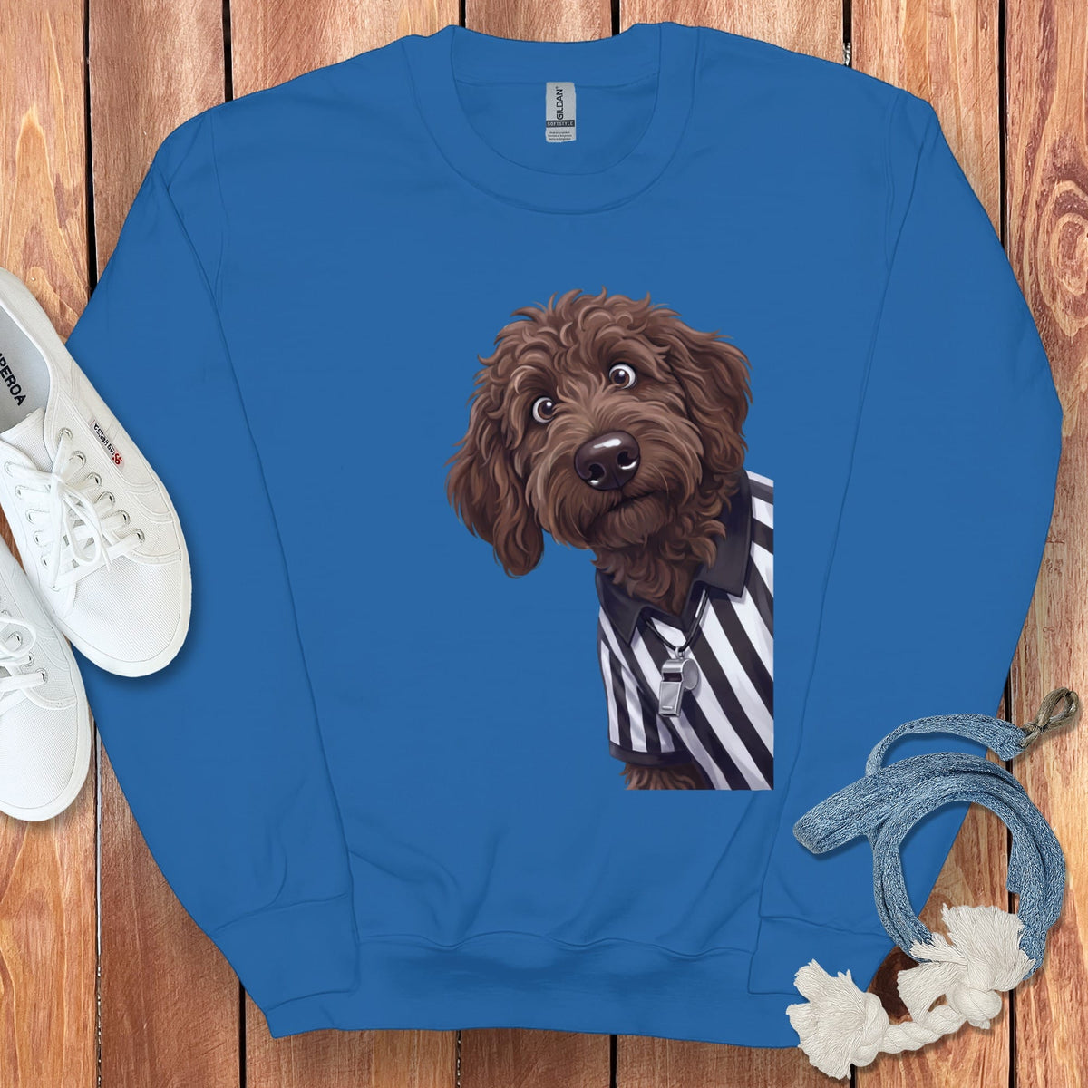 Blue sweatshirt with cartoon doodle dog wearing referee shirt and whistle
