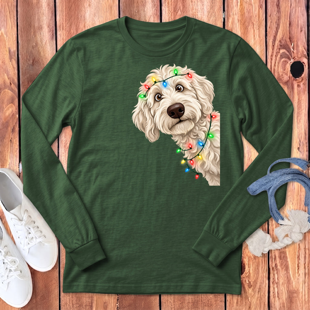 Green long-sleeved shirt with a doodle dog wearing colorful Christmas lights graphic.