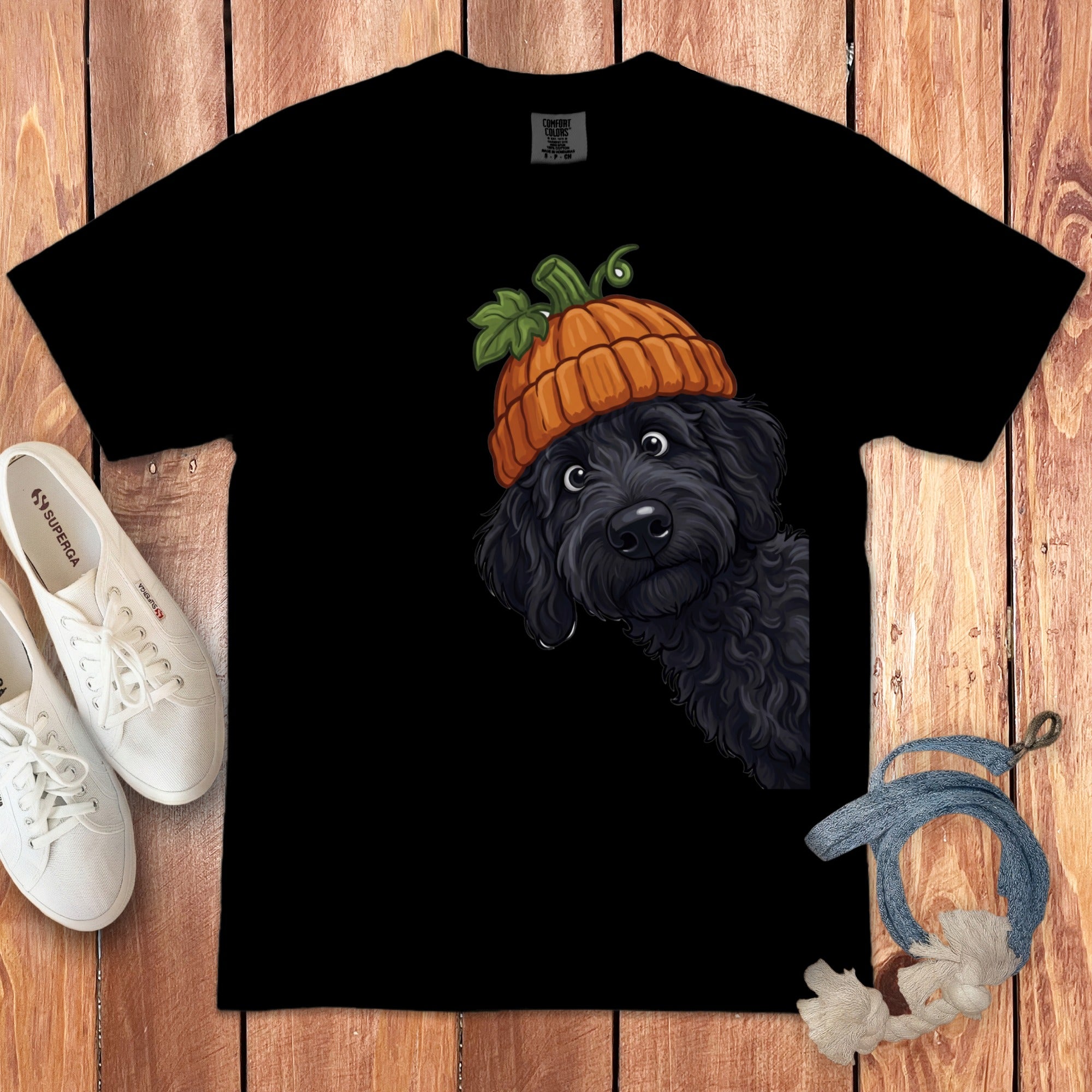 Black t-shirt with a black dog wearing a pumpkin hat illustration.