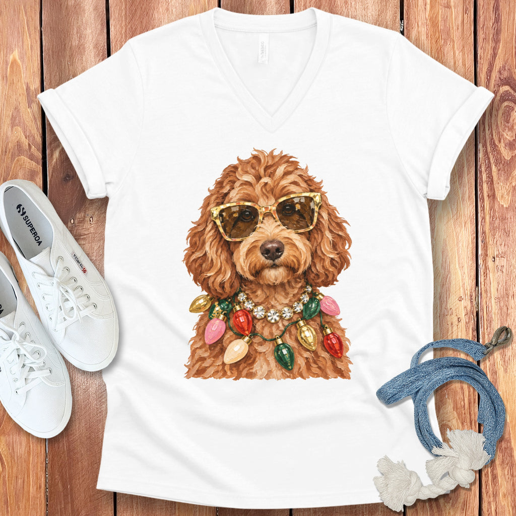 White v-neck t-shirt with watercolor illustration of a brown dog wearing sunglasses and a Christmas light necklace.