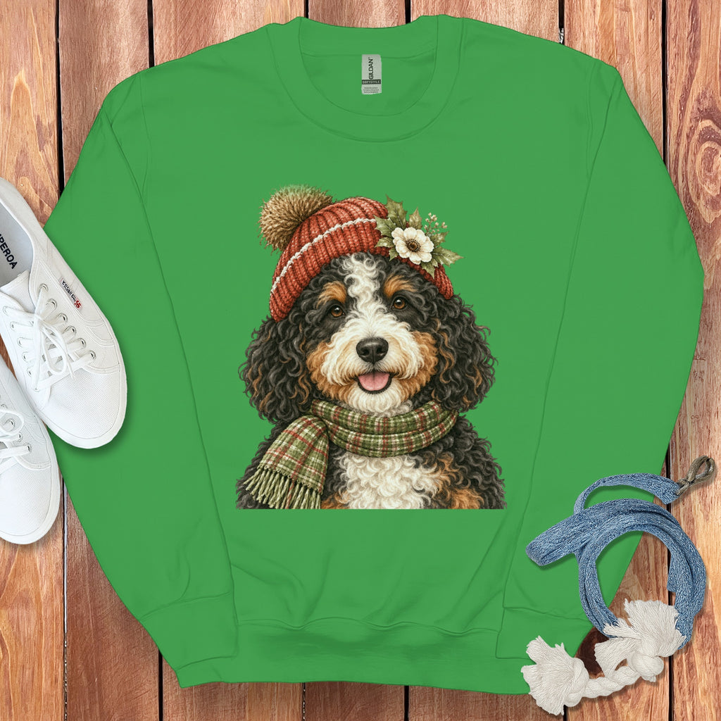 Green sweatshirt with a Bernese Mountain Dog wearing a knit hat and scarf.