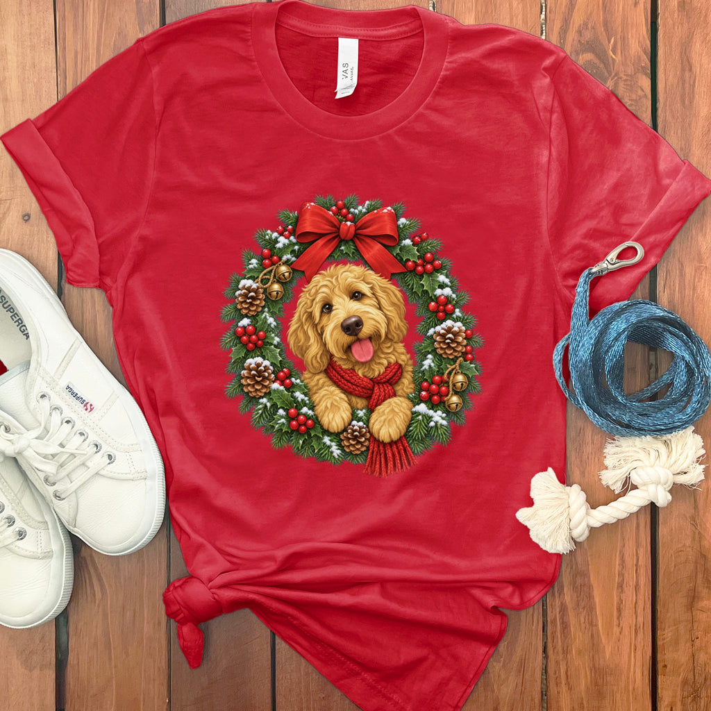 Red t-shirt featuring a goldendoodle wearing a red scarf inside a Christmas wreath.